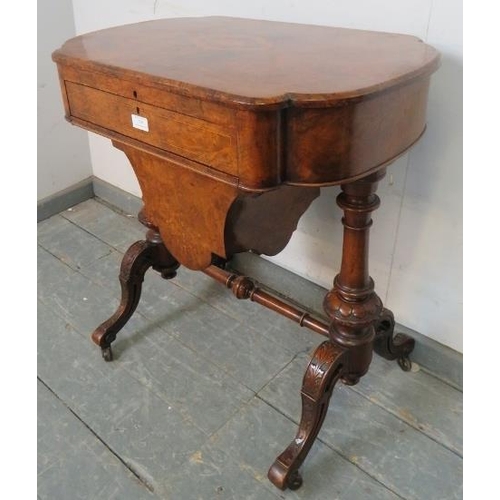 709 - A 19th century burr walnut writing table by Marvin cabinet makers, London, the lid opening onto a fi... 