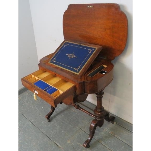 709 - A 19th century burr walnut writing table by Marvin cabinet makers, London, the lid opening onto a fi... 