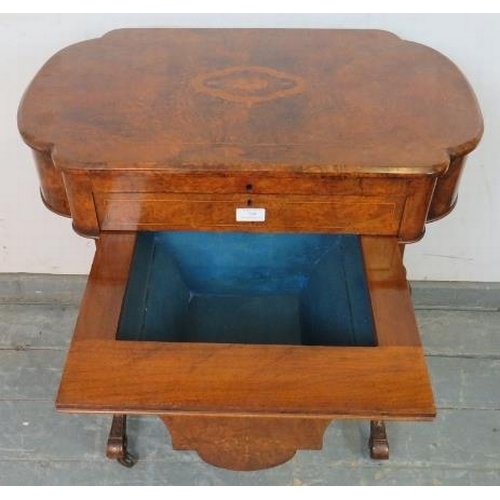 709 - A 19th century burr walnut writing table by Marvin cabinet makers, London, the lid opening onto a fi... 