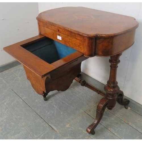 709 - A 19th century burr walnut writing table by Marvin cabinet makers, London, the lid opening onto a fi... 