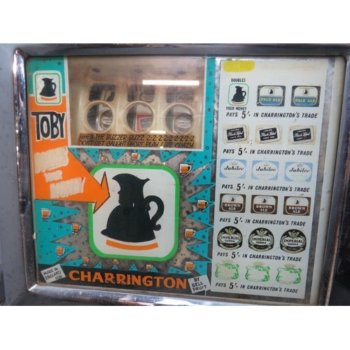 711 - A vintage Charrington’s themed chromed one-armed bandit mechanical slot machine by Bell Fruit. Inclu... 