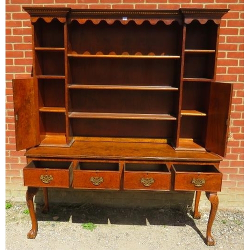 719 - A good quality Georgian style burr elm dresser, the top section with dentil cornice and shaped canop... 