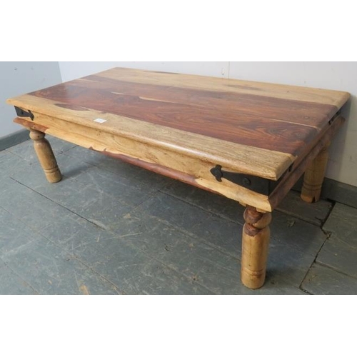 721 - An Eastern Jali wood rectangular coffee table, with metal bound corners, on turned supports. 
H40 W1... 