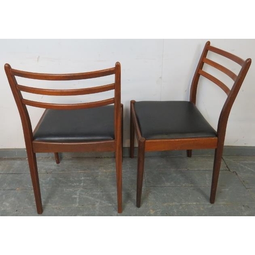 725 - A set of four mid-century teak dining chairs by Victor Wilkins for G-Plan, with slatted backs and dr... 