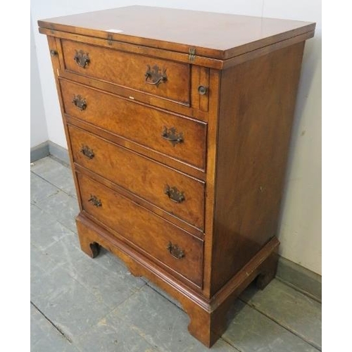 732 - A Georgian style walnut Batcheler’s chest, the folding top above four graduated cock-beaded drawers ... 