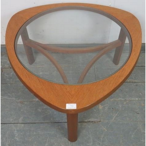 733 - A mid-century teak ‘astro’ coffee table by Nathan, with glass insert, on turned supports with curved... 