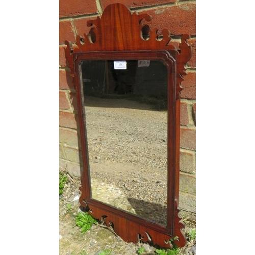 734 - A Georgian mahogany wall mirror, within a shaped surround. 
H69 W42
Condition report: Minor veneer l... 