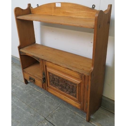 737 - An Arts & Crafts Period light oak wall hanging shelf with single cupboard under and one small oak li... 