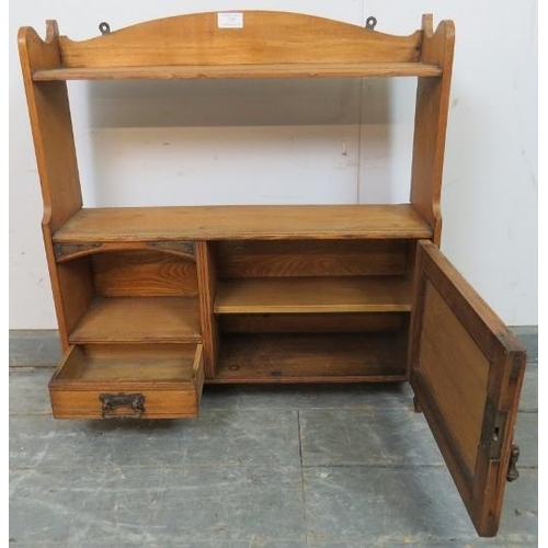 737 - An Arts & Crafts Period light oak wall hanging shelf with single cupboard under and one small oak li... 