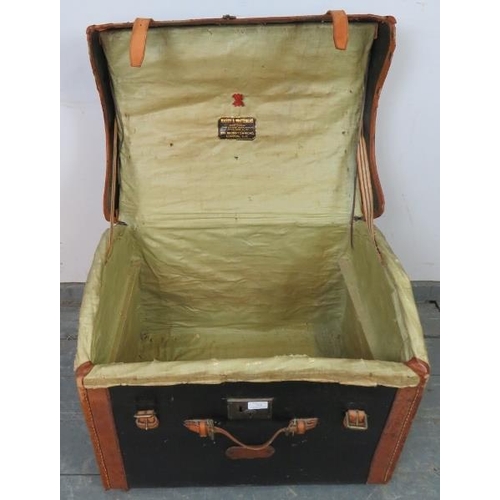 738 - An antique leather-bound travelling trunk by Mason & Whitehead of Brompton Rd, London with stencille... 