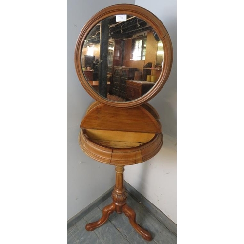 740 - A Victorian walnut Gentleman’s shaving stand, having a circular height-adjustable mirror above two l... 