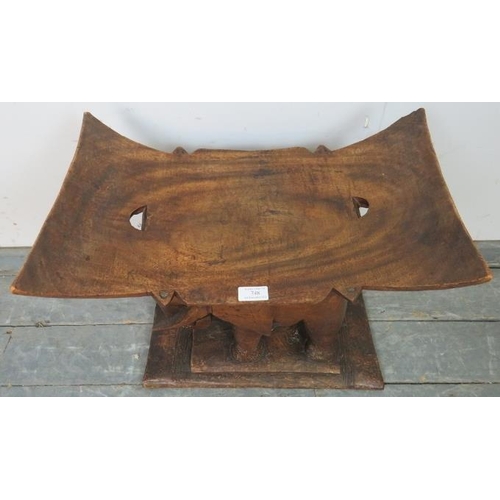 748 - A vintage teak stool in the form of an elephant, on a plinth base. 
H51 W54 D32
Condition report: So... 