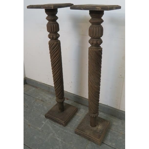 749 - A pair of antique mahogany plant stands, with fluted and spiral carved columns, on plinth bases. 
H9... 