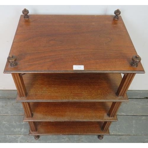 754 - An Edwardian mahogany freestanding four-tier whatnot of small proportions, having turned finials and... 