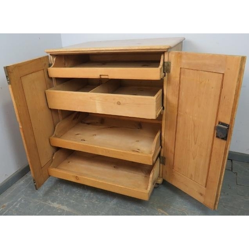 758 - An antique stripped pine pantry cupboard, housing four pull out slides, on bun feet. 
H103 W88 D65
C... 