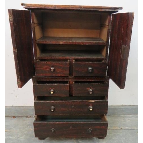 760 - An antique stained pine apprentice piece linen press, the top section with shelf above two short dra... 