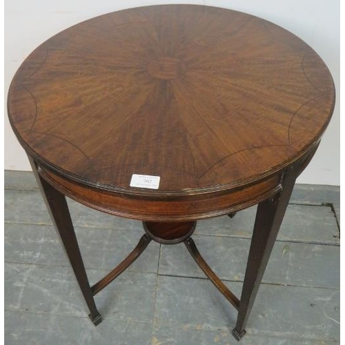 762 - An Edwardian mahogany occasional table strung with ebony, on tapering square supports united by a br... 