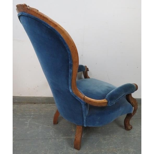 774 - A Victorian walnut spoonback open-sided armchair, upholstered in buttoned royal blue velvet material... 