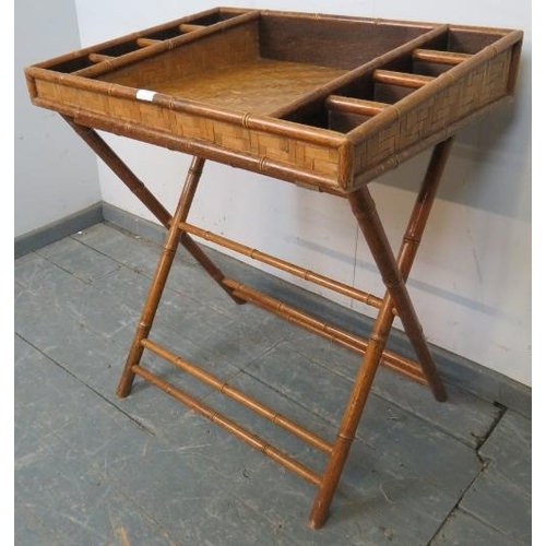 777 - A vintage faux bamboo butler’s tray on stand, having divided internal compartments and parquetry sty... 