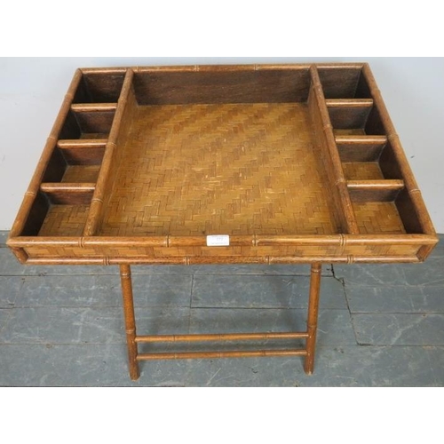 777 - A vintage faux bamboo butler’s tray on stand, having divided internal compartments and parquetry sty... 