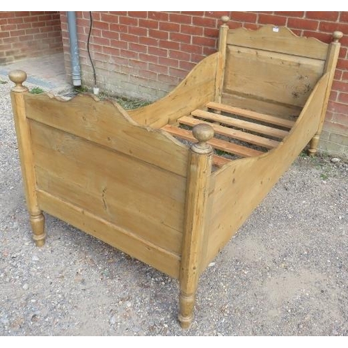 778 - An antique   stripped pine single sleigh bed, with ball finials, on tapering turned supports. 
H92 W... 