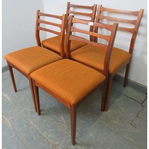 783 - A set of four mid-century teak dining chairs with slatted backs and seats upholstered in burnt orang... 