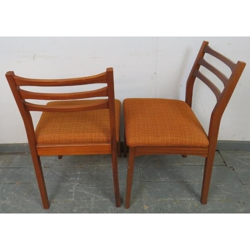 783 - A set of four mid-century teak dining chairs with slatted backs and seats upholstered in burnt orang... 