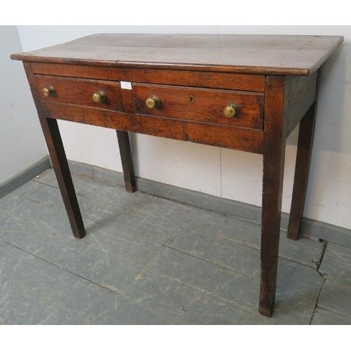 785 - An 18th century oak side table of good colour, housing two short drawers with brass knob handles and... 