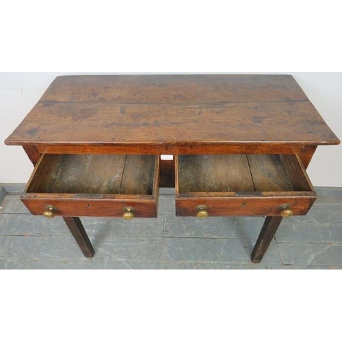 785 - An 18th century oak side table of good colour, housing two short drawers with brass knob handles and... 