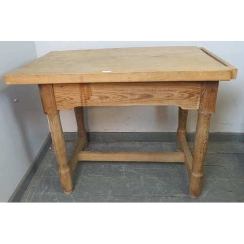 798 - A vintage beech butcher’s block, on a pitch pine base with single drawer, on turned supports with an... 