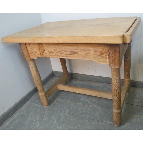 798 - A vintage beech butcher’s block, on a pitch pine base with single drawer, on turned supports with an... 