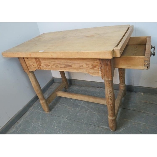 798 - A vintage beech butcher’s block, on a pitch pine base with single drawer, on turned supports with an... 