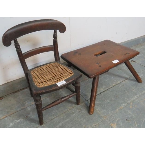 805 - A small rustic 19th century fruitwood stool, on steeply canted oak supports, together with an antiqu... 