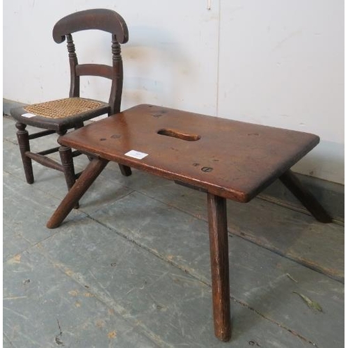 805 - A small rustic 19th century fruitwood stool, on steeply canted oak supports, together with an antiqu... 