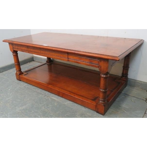 810 - A good quality cherrywood rectangular coffee table with single blind drawer, on turned and block sup... 