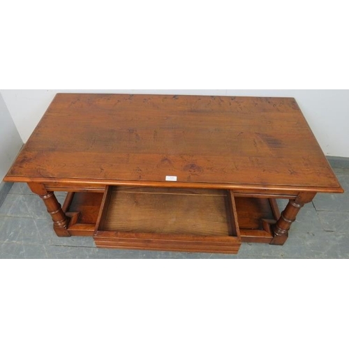 810 - A good quality cherrywood rectangular coffee table with single blind drawer, on turned and block sup... 