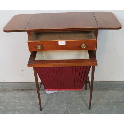 812 - An Edwardian mahogany drop-leaf worktable, strung with satinwood, housing one long drawer with press... 