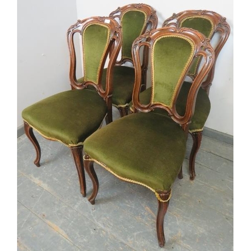 815 - Four Victorian mahogany dining chairs, with acanthus carved backs, upholstered in green velvet mater... 