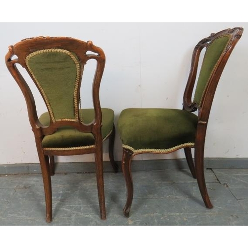 815 - Four Victorian mahogany dining chairs, with acanthus carved backs, upholstered in green velvet mater... 