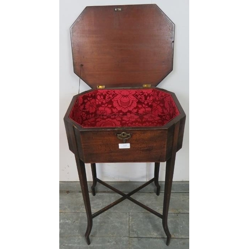 820 - A Georgian mahogany worktable of octagonal form with brass handles to either side, on tapering squar... 