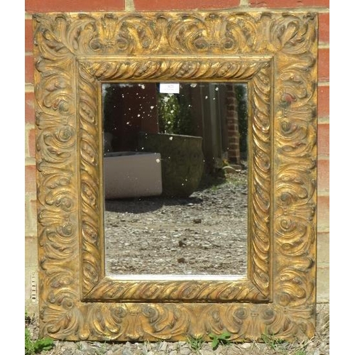 825 - A vintage wall mirror within an acanthus carved giltwood frame in the Florentine taste. 
H67 W57
Con... 