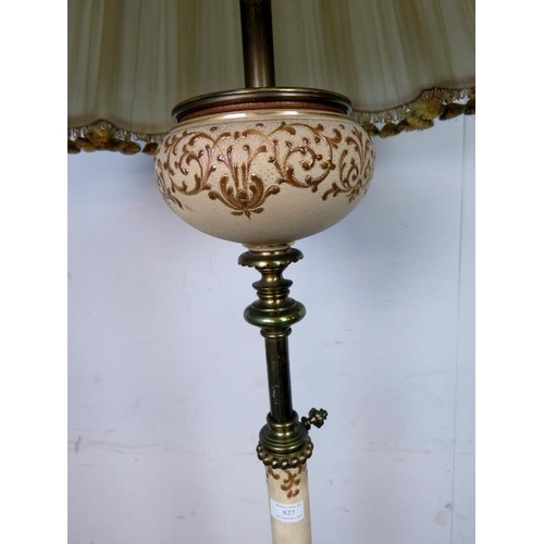 827 - An ornate vintage brass and ceramic height adjustable standard lamp, on a circular plinth base with ... 