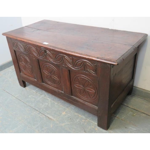 833 - A late 17th/early 18th century oak panelled coffer with internal candle box, retaining the original ... 