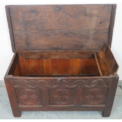 833 - A late 17th/early 18th century oak panelled coffer with internal candle box, retaining the original ... 