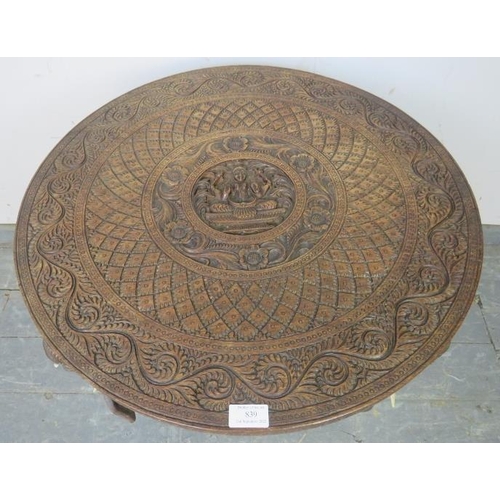 839 - A well-carved vintage Anglo Indian elephant table, the top carved in high relief with central panel ... 