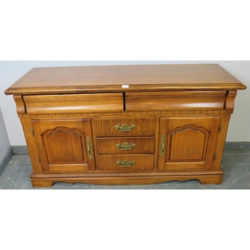 851 - A vintage antique-style walnut sideboard, housing two blind drawers above three short drawers and tw... 