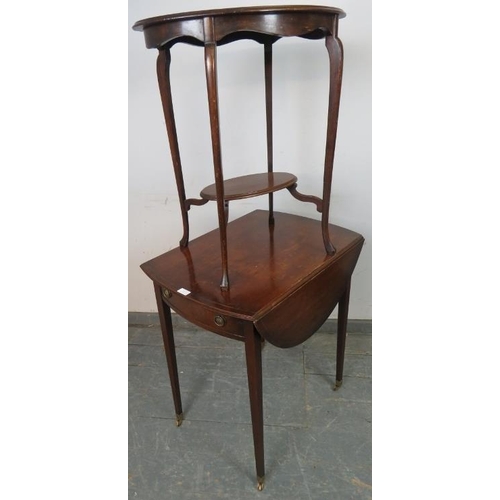 853 - A vintage mahogany drop leaf oval table in the Regency taste, housing single drawer with brass drop-... 