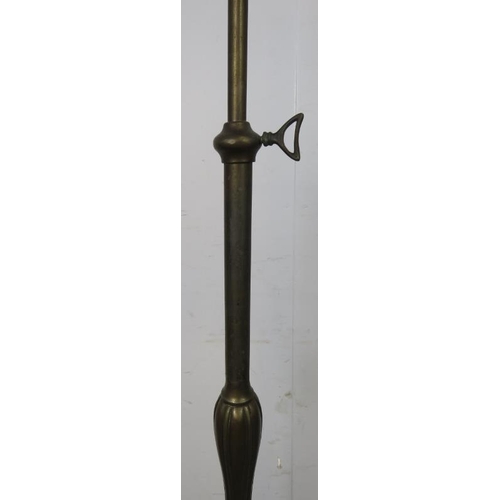 856 - A vintage bronzed height adjustable standard lamp in the Art Nouveau taste, on a circular plinth bas... 