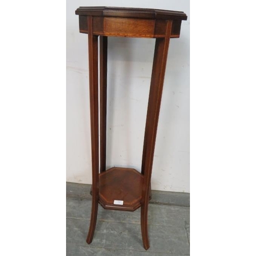 859 - An Edwardian mahogany octagonal two-tier plant stand, strung with satinwood and ebony, on splayed su... 