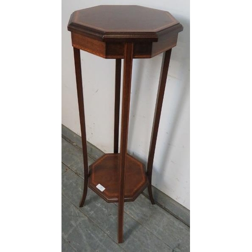 859 - An Edwardian mahogany octagonal two-tier plant stand, strung with satinwood and ebony, on splayed su... 